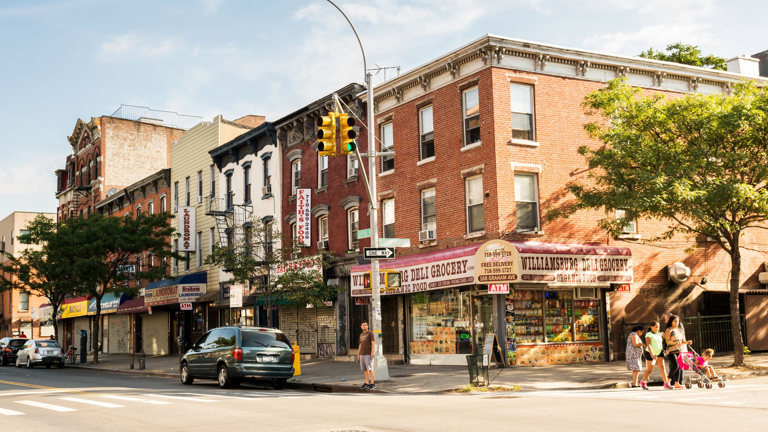 Image may contain City Neighborhood Road Street Urban Person Car Transportation Vehicle and Apartment Building
